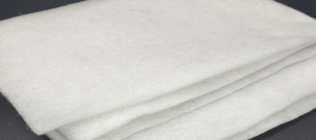 Processing technology and application of calcium carbonate in needle-punched non-woven fabrics